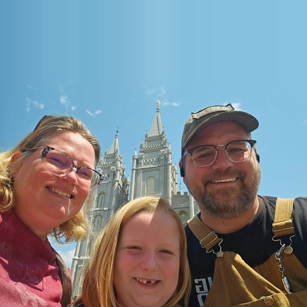 The Doerner family smiling in front of the Salt Lake Temple